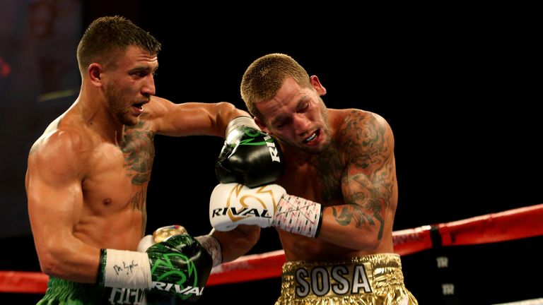 OXON HILL, MD - APRIL 8: Jason Sosa (R) exchanges punches with Vasyl Lomachenko of Ukraine during their WBO Super Featherweight World Championship bout at 