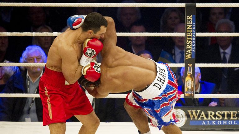 Ukrainian IBF and WBO world champion Wladimir Klitschko (L) fights opponent British WBA champion David Haye (L) during their heavyweight title boxing match