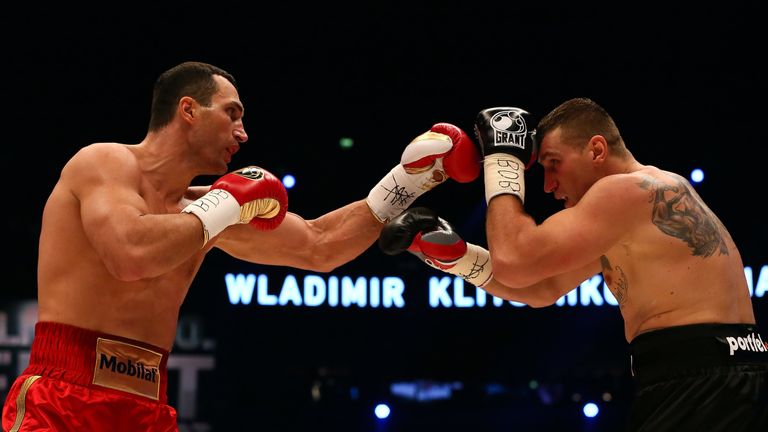 Wladimir Klitschko (L) of Ukraine exchange punches with Mariusz Wach (R) 2012