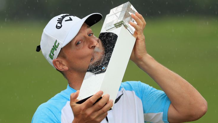 Alex Noren of Sweden poses with the trophy after winning the BMW PGA Championship at Wentworth 