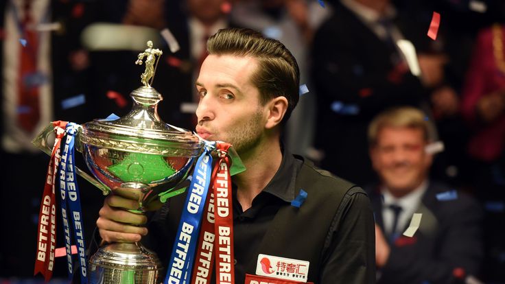 England's Mark Selby kisses the trophy after beating Scotland's John Higgins in the World Championship Snooker final at The Crucible in Sheffield