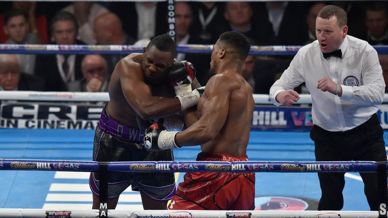 LONDON, ENGLAND - DECEMBER 12:  Anthony Joshua MBE (r) lands an uppercut on Dillian Whyte during the Commonwealth Heavyweight title, Vacant British Heavywe