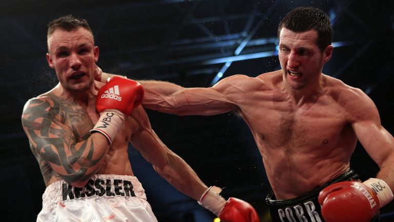 HERNING, DENMARK - APRIL 24:  Carl Froch of England (R) connects with a right against Mikkel Kessler of Denmark during their Super Six WBC Super Middleweig