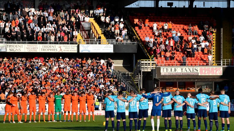 Dundee United and Hamilton observe a minute's silence at Tannadice.