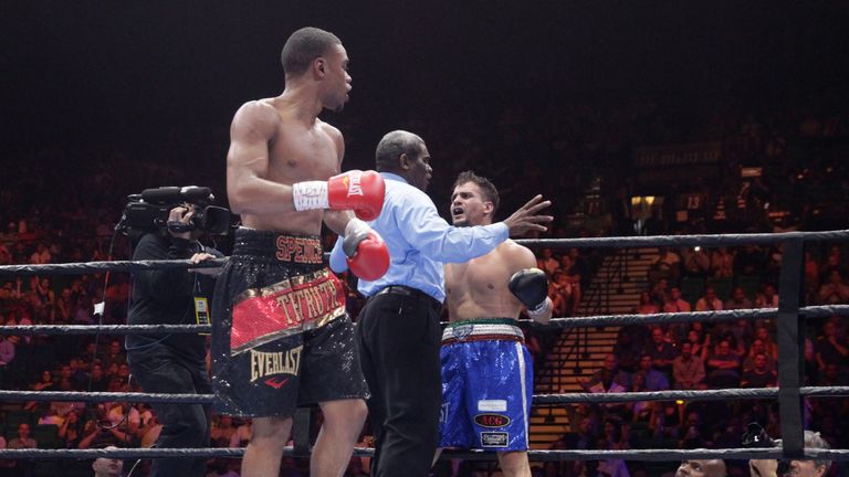 LAS VEGAS, NV - JUNE 20:  Referee Robert Byrd stops a welterweight fight between Errol Spence Jr. (L) and Phil Lo Greco at MGM Grand Garden Arena on June 2