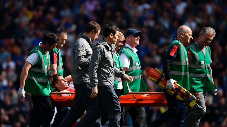 Gabriel is stretchered off against Everton at the Emirates