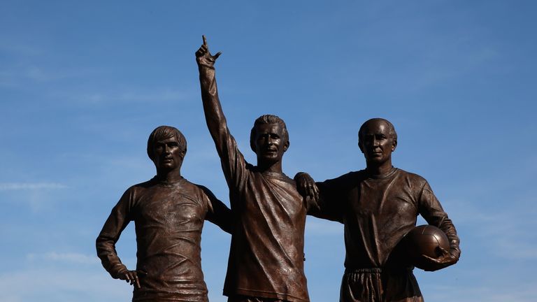Statue of Manchester United legends George Best, Denis Law and Bobby Charlton is seen outside Old Trafford