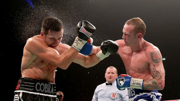 MANCHESTER, ENGLAND - NOVEMBER 23:  Carl Froch (L) in action with George Groves during their IBF and WBA World Super Middleweight bout at Phones4u Arena on