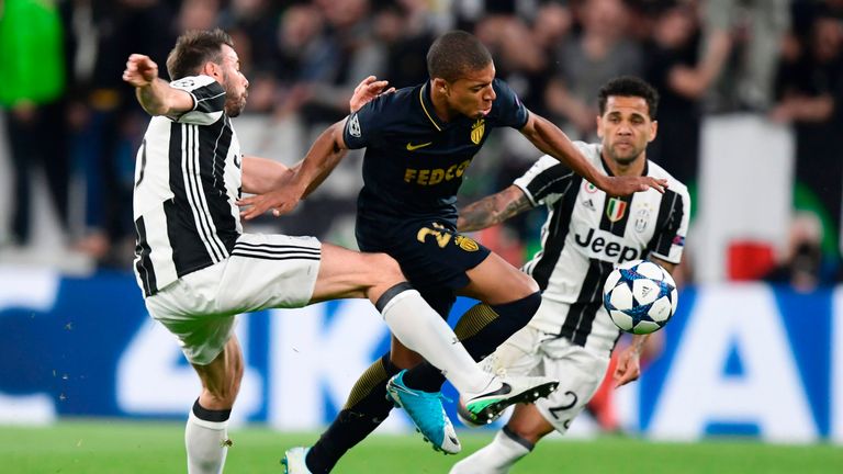 Juventus defender Andrea Barzagli (L) vies with Monaco's Kylian Mbappe during the UEFA Champions League semi-final second leg in Turin