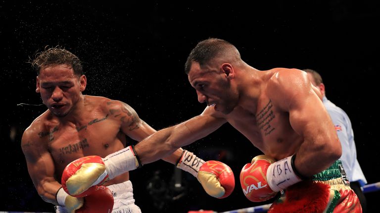 MANCHESTER, ENGLAND - DECEMBER 10:  Kal Yafai of Birmingham (red shorts, green gold trim) on his way to beating Luis Concepcion of Panama during their WBA 