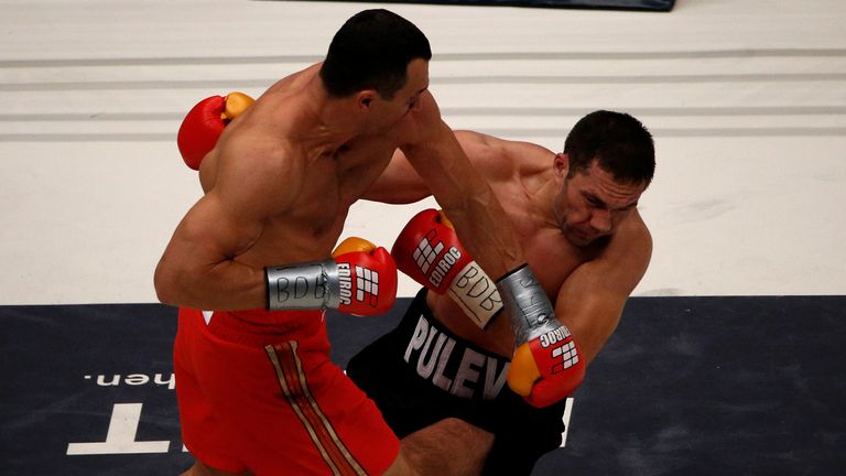 Wladimir Klitschko (R) of Ukraine exchanges punches with Kubrat Pulev