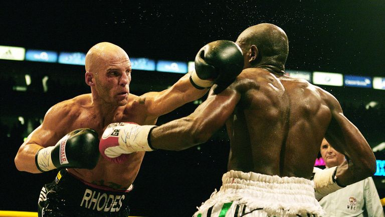 British middleweight Ryan Rhodes (L) punches South African Vincent Vuma (R) during their WBC title boxing match at the O2 arena, London on November 15, 200