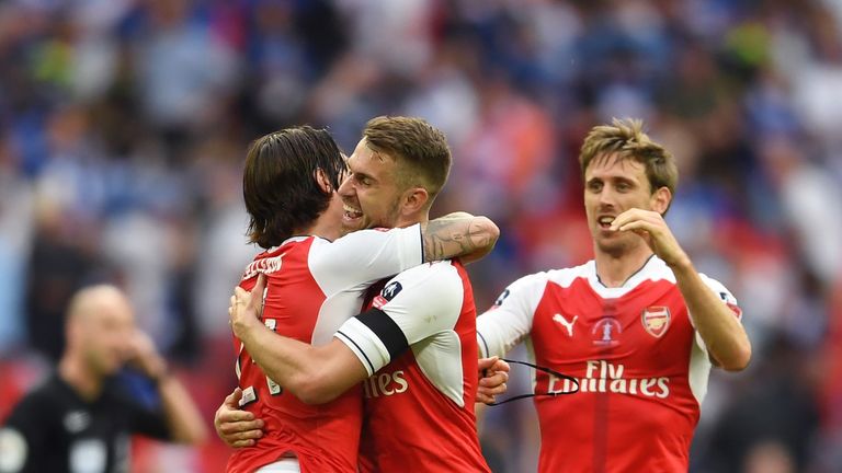 Hector Bellerin of Arsenal, Aaron Ramsey of Arsenal and Nacho Monreal of Arsenal celebrate after The Emirates FA Cup Final win v Chelsea