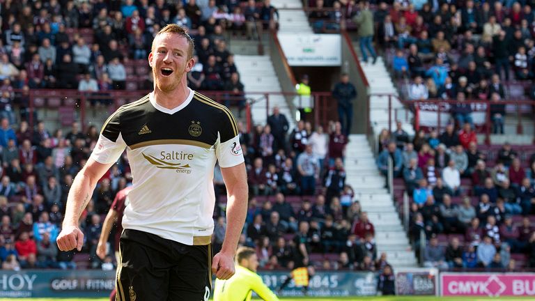 Aberdeen's Adam Rooney celebrates after scoring the opening goal.