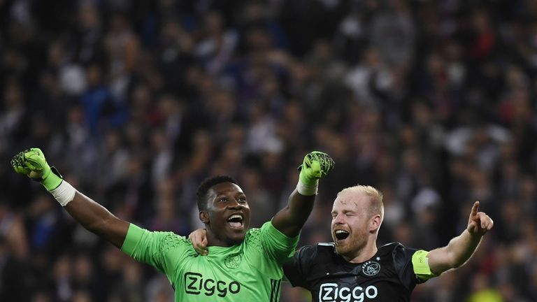 Ajax' Dutch midfielder Davy Klaassen (R) and Ajax's English goalkeeper Andre Onana (L) celebrates their victory in the Europa League semi-final football ma