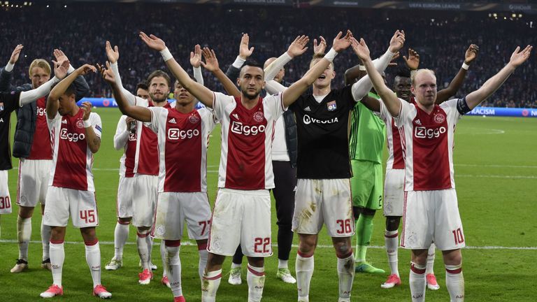 Ajax players celebrate after the 4-1 victory against Lyon