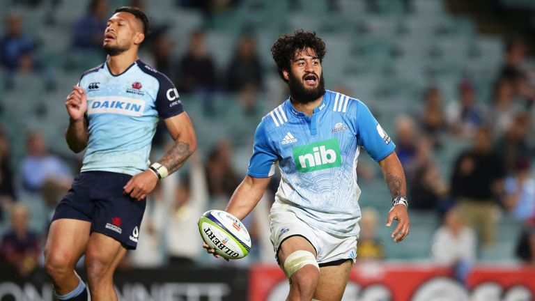 SYDNEY, AUSTRALIA - MAY 06:  Akira Ioane of the Blues celebrates scoring a try as Israel Folau of the Waratahs looks on during the round 11 Super Rugby mat