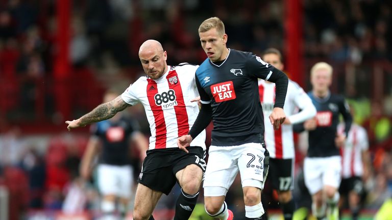 BRENTFORD, ENGLAND - APRIL 14:  Alan McCormack of Brentford tackles Matej Vydra of Derby County during the Sky Bet Championship match between Brentford and