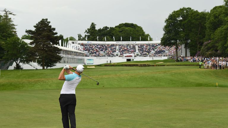 Alex Noren of Sweden hits his second shot into the 18th green during day four of the BMW PGA Championship at Wentworth