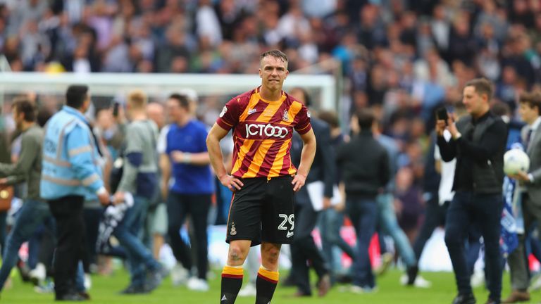 LONDON, ENGLAND - MAY 20:  Anthony McMahon of Bradford City looks dejected in defeat as fans invade the pitch after the Sky Bet League One Playoff Final be