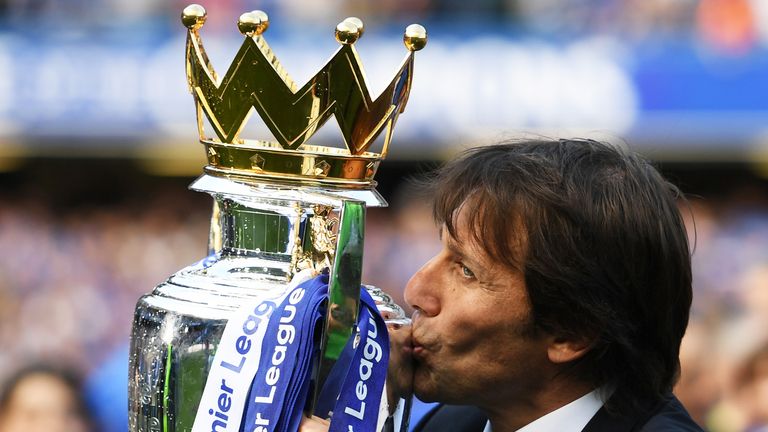 Antonio Conte kisses the Premier League trophy after the 5-1 win over Sunderland