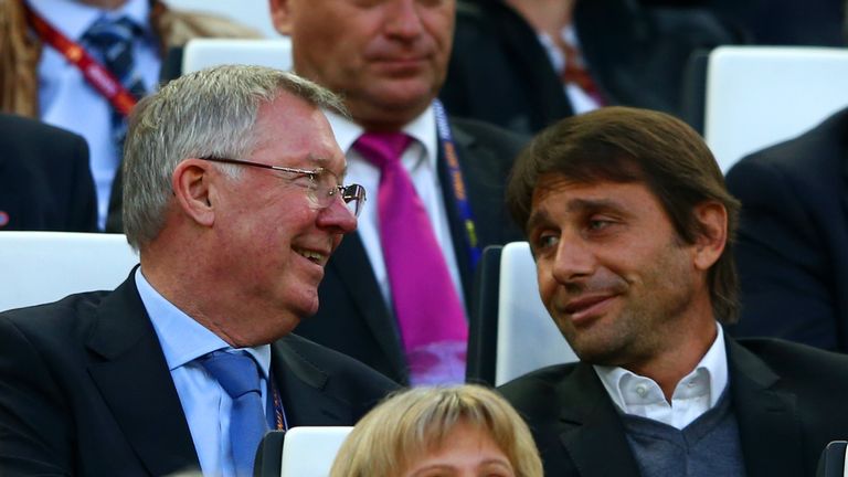 TURIN, ITALY - MAY 14:  Sir Alex Ferguson (L) speaks with Juventus manager Antonio Conte during the UEFA Europa League Final match between Sevilla FC and S