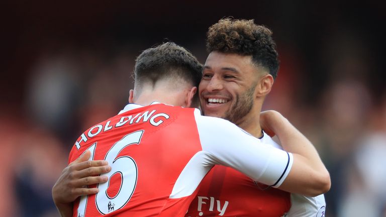 Rob Holding and Alex Oxlade-Chamberlain celebrate Arsenal's win over Manchester United 