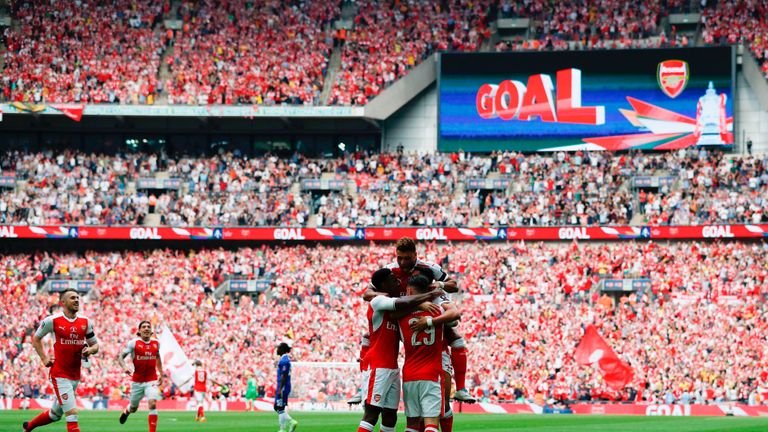 Arsenal's Alexis Sanchez celebrates with team-mates after scoring the opening goal of the FA Cup final v Chelsea