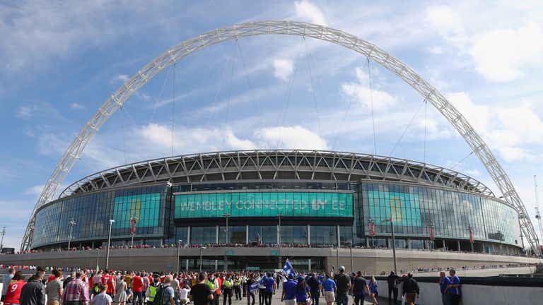 LONDON, ENGLAND - MAY 27:  Fans arrive at the stadium prior to The Emirates FA Cup Final between Arsenal and Chelsea at Wembley Stadium on May 27, 2017 in 