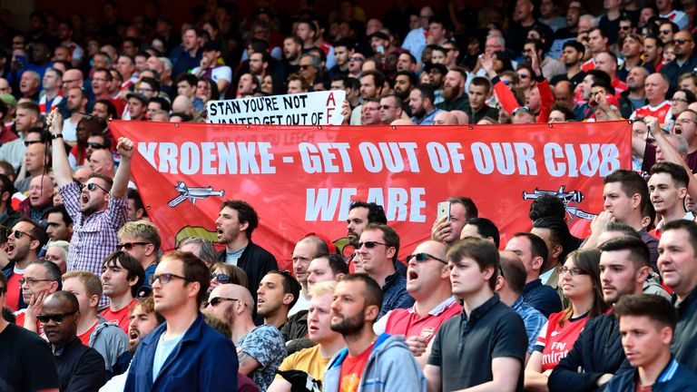Arsenal fans hold up a banner against Arsenal's majority owner Stan Kroenke during the English Premier League football match v Everton