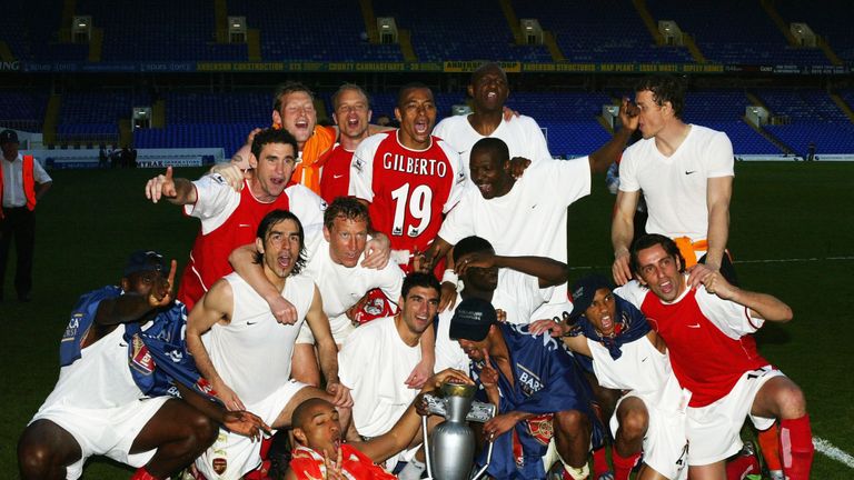 Arsenal celebrate at the end off the FA Barclaycard Premiership match between Tottenham and Arsenal at White Hart Lane on April 25, 2004 in London.  