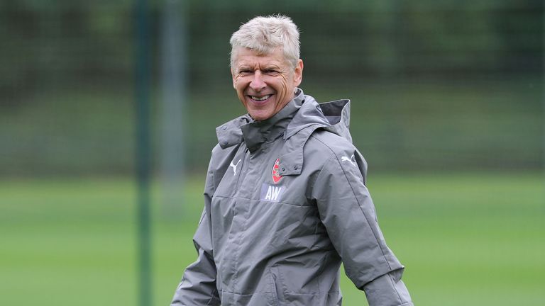 Arsene Wenger smiles during a training session at London Colney on September 27, 2016