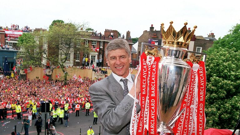 LONDON, ENGLAND - MAY 19:  Arsenal manager Arsene Wenger holds the Premier League trophy at Islington Town Hall on May 19, 2004 in London, England.  (Photo