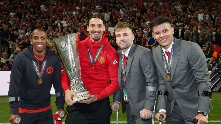 Ashley Young, Zlatan Ibrahimovic, Luke Shaw and Marcos Rojo celebrate with the Europa League trophy 