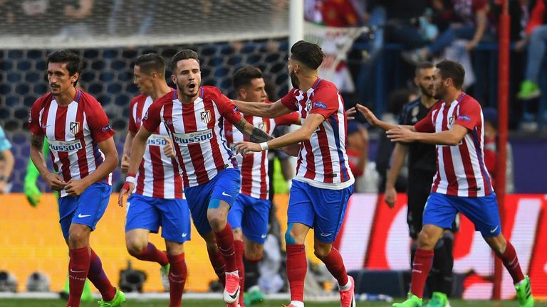 Saul Niquez celebrates with team-mates after scoring Atletico's opening goal