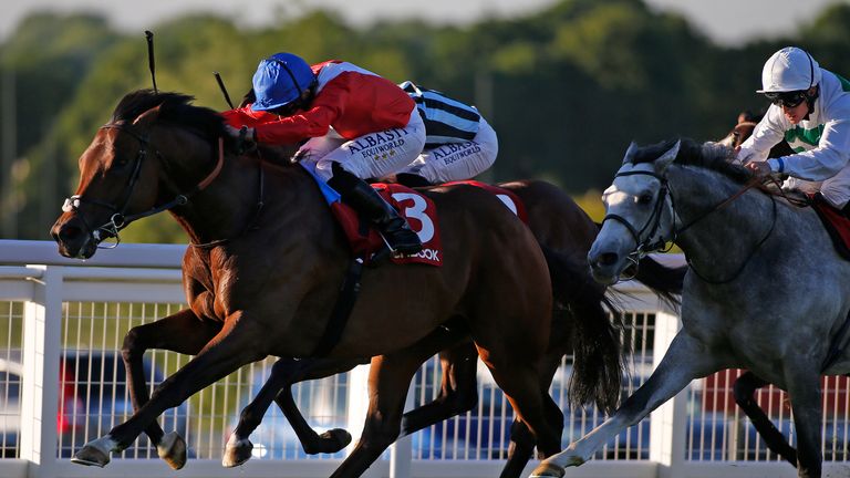 Ryan Moore riding Autocratic (red) win the Matchbook Brigadier Gerard Stakes at Sandown 