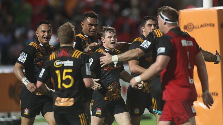 SUVA, FIJI - JULY 01: Brad Weber of the Chiefs (C) celebrates his try during the round 15 Super Rugby match between the Chiefs and the Crusaders at ANZ Sta