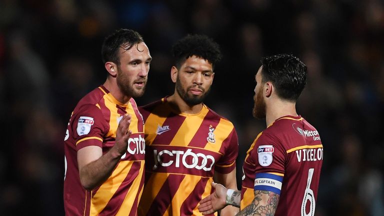 BRADFORD, ENGLAND - MAY 04:  Winning goal scorer Rory McArdle of Bradford City (L) celebrates with team mates Nat Knight-Percival and Romain Vincelot of Br