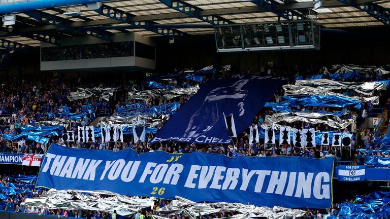 Fans display banners in support of their departing captain John Terry ahead of match between Chelsea and Sunderland at Stamford Bridge on May 21, 2017.