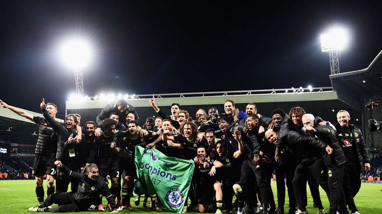 Chelsea players and staff celebrate after clinching the title