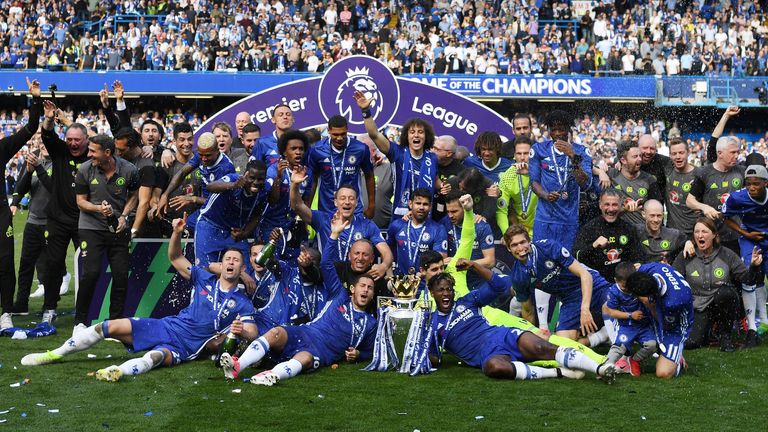 The Chelsea team celebrate with the Premier League trophy 