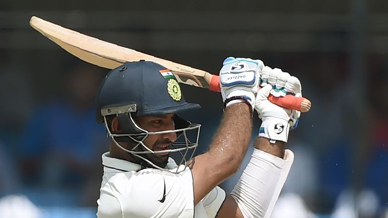 Indian batsman Cheteshwar Pujara plays a shot during the fourth day of third Test cricket match between India and New Zealand at The Holkar Cricket Stadium