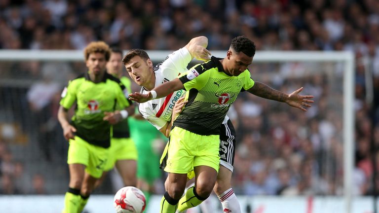 Fulham striker Chris Martin battles for the ball with Reading's Liam Moore