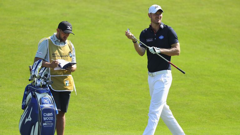 VIRGINIA WATER, ENGLAND - MAY 25:  Chris Wood of England looks on with caddie Mark Crane on the 7th hole during day one of the BMW PGA Championship at Went