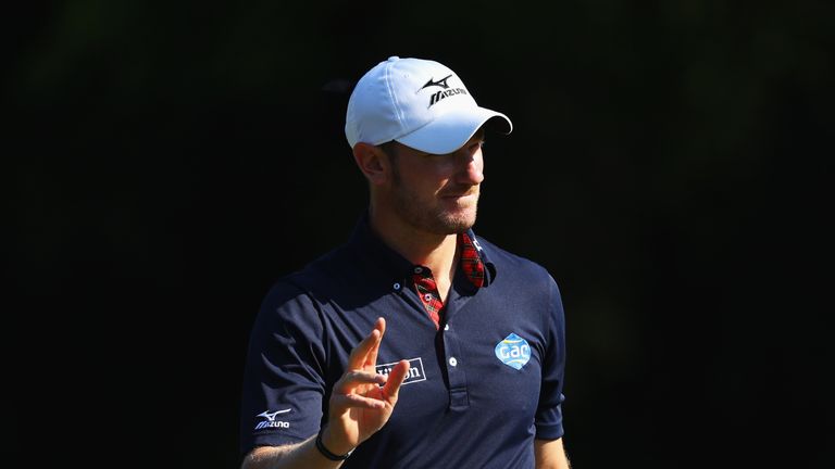 VIRGINIA WATER, ENGLAND - MAY 25: Chris Wood of England acknowledges the crowd on the 4th green during day one of the BMW PGA Championship at Wentworth on 