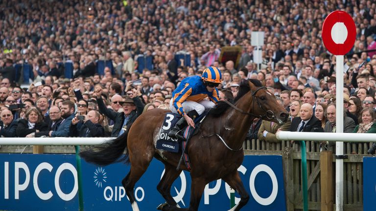 Churchill ridden by Ryan Moore crosses the line to win the Qipco 2000 Guineas