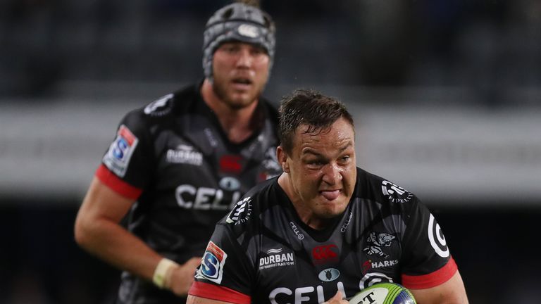 Coenie Oosthuizen  carries for the Sharks