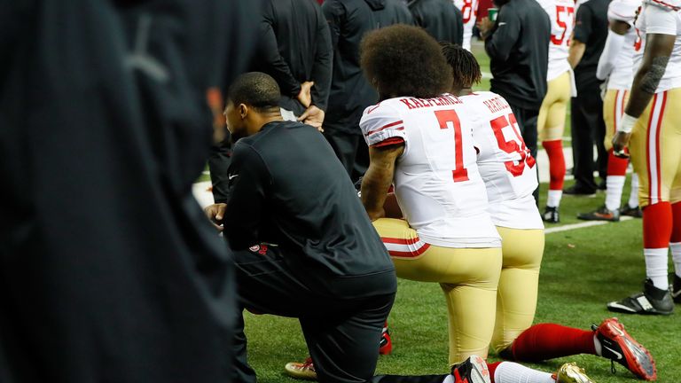 ATLANTA, GA - DECEMBER 18: Colin Kaepernick #7 of the San Francisco 49ers and Eli Harold #58 kneel during the National Anthem prior to the game against the