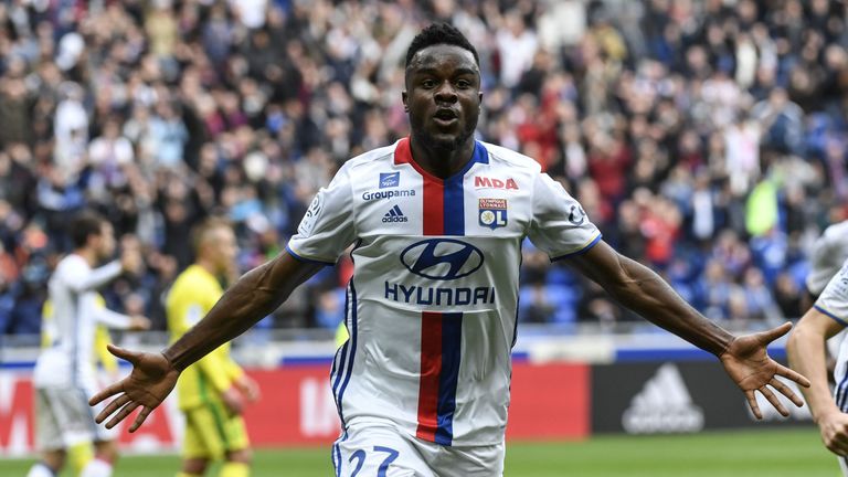 Lyon's French forward Maxwel Cornet reacts after scoring during the French Ligue 1 football match between Olympique Lyonnais and FC Nantes.
