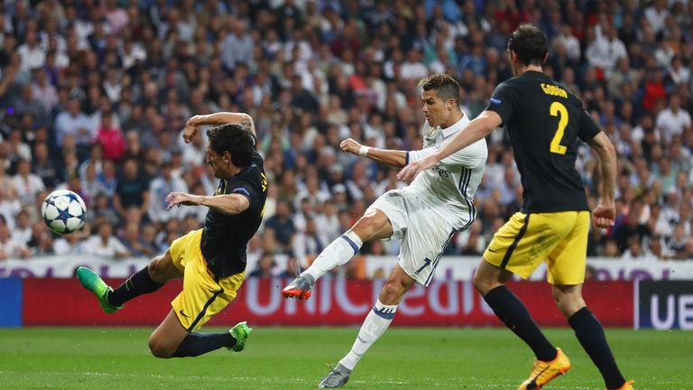 Cristiano Ronaldo of Real Madrid (C) scores their second goal during the UEFA Champions League semi-final first leg match v Atletico at the Bernabeu